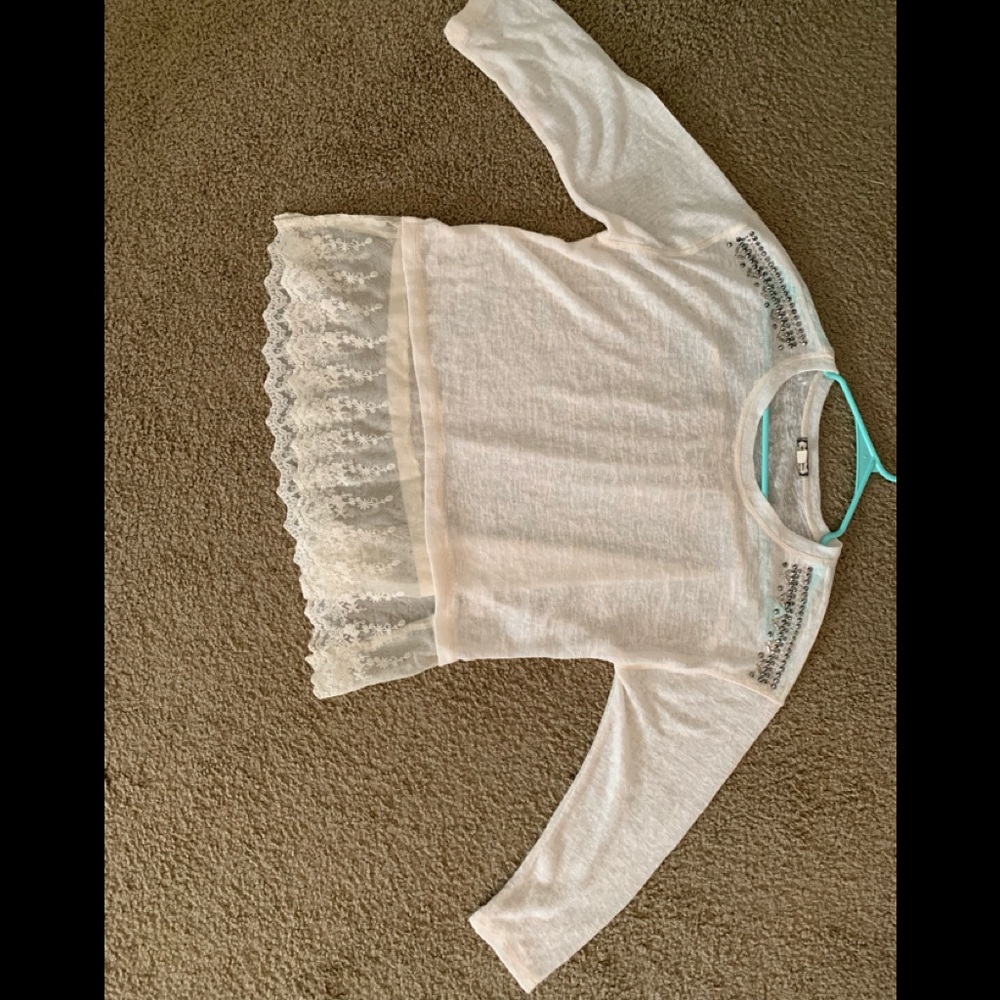 Ivory top with stone detail on shoulder